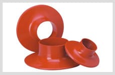 A moulded heat-shrink rain shed: a skirted ring that shrinks down onto an insulated cable core to add creepage