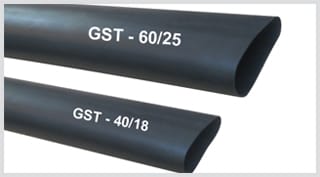 Two lengths of thick-walled matt black heat-shrink tubing cut at an angle, printed along the wall GST - 60/25 on the upper length and GST - 40/18 on the lower